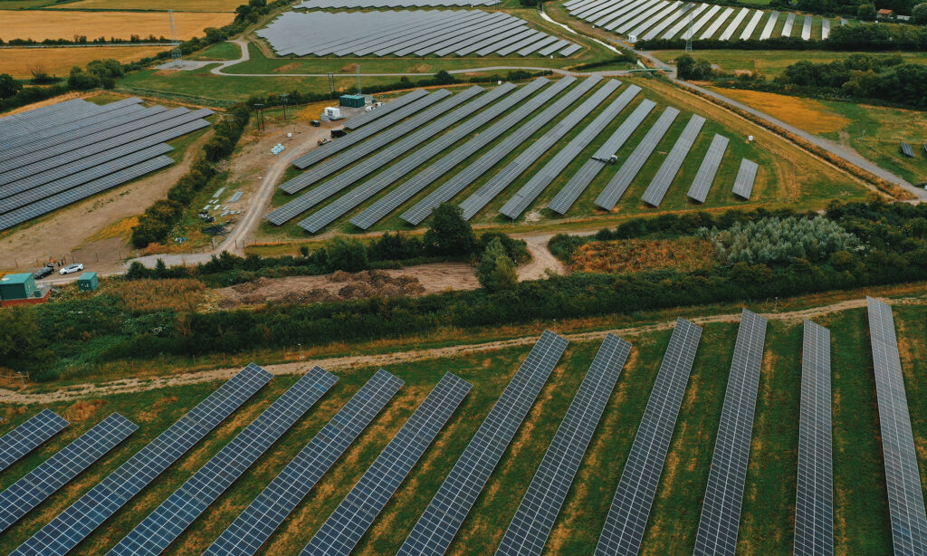 Image shows a birdeye view of the Bowerhouse II Solar farm, fields filled with solar panels.