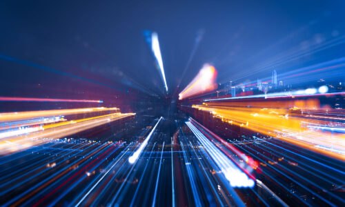 A city scape but captured in fast motion so nothing is clear, it's like it's zooming away from the screen.