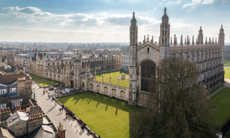 An aerial view of Cambridge University showcasing the campus and green surrounding it.
